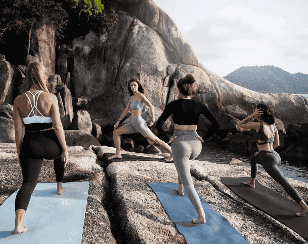 full-shot-women-stretching-yoga-mats (1)